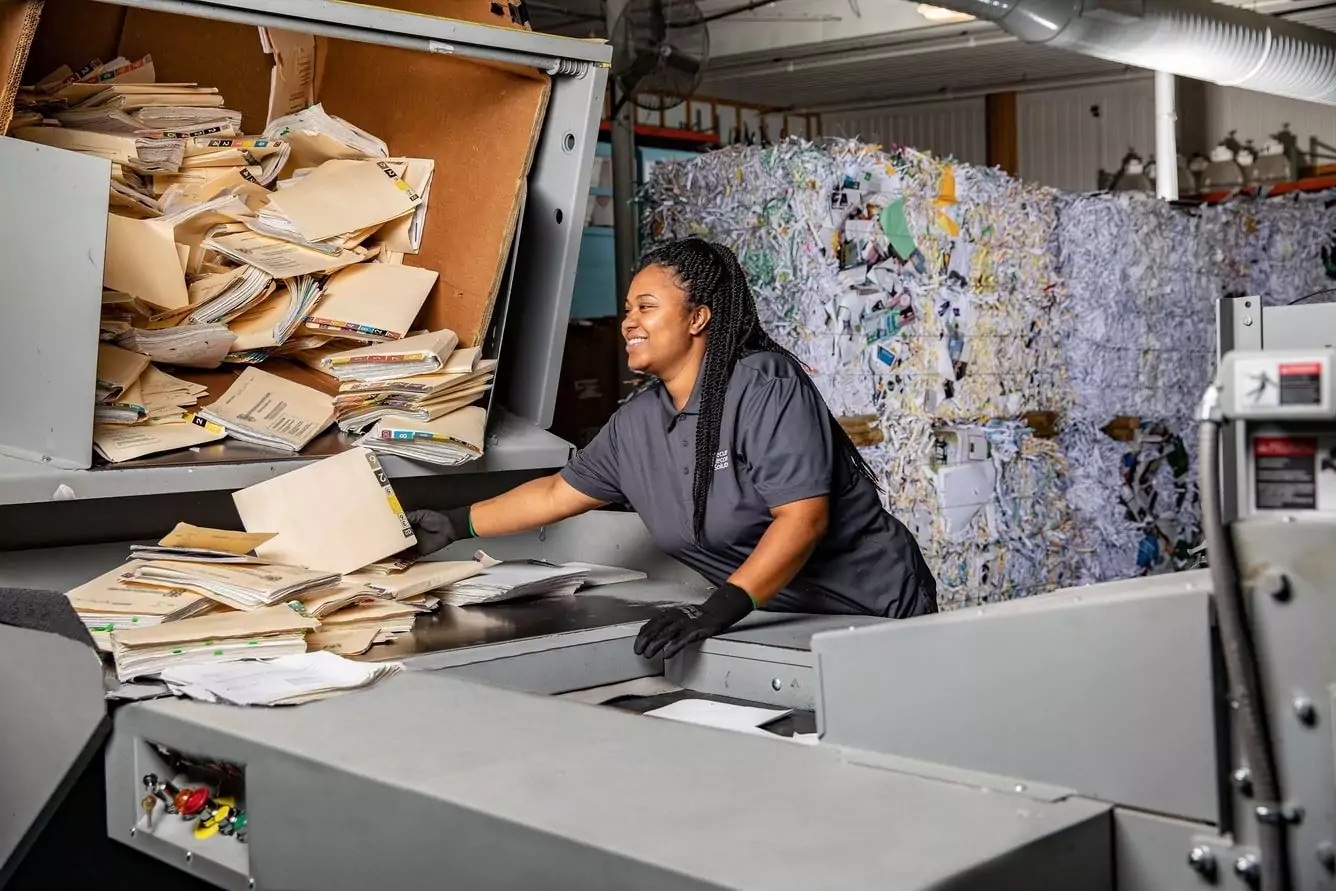 Vanessa with Secure Records Solutions shredding documents at our secure shred facility 